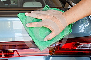 Hand wipe back of the car