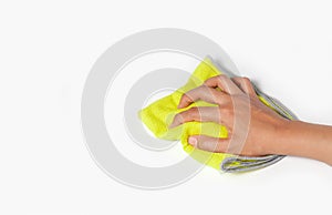 Hand wiping surface with green rag isolated on white