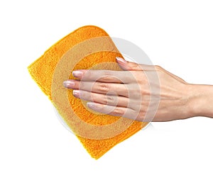 Hand wiping surface with orange rag isolated on white