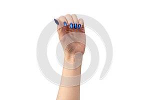 Hand of a woman with blue nails isolated on a white background