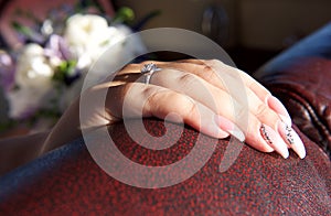 Hand of woman close up. Hand of bride with nice ring. Hand of the bride isolated in blurry background. Bride going to the ceremony