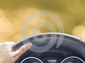 Hand of woman driving car