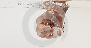 Hand of Woman entering Water