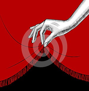 Hand of woman lifting the edge of the red curtain