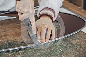 hand of woman master glassmaker at work