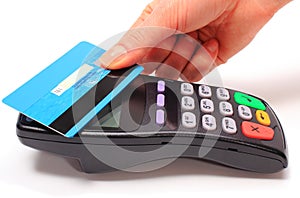 Hand of woman paying with contactless credit card, NFC technology