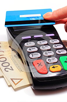 Hand of woman paying with contactless credit card, NFC technology