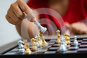 Hand of woman playing chess for business tactic and planning met