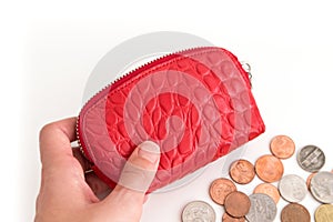 Hand of a woman with a red coin purse
