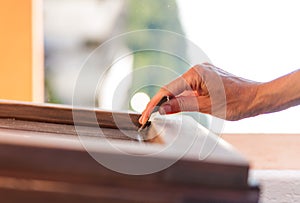 Hand of a woman sanding fixtures