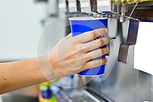 Hand of woman serving beverage of cooler