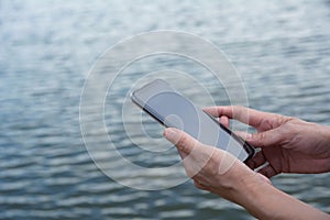 Hand of woman using smartphone, personal chat, and social media