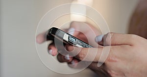 Hand of woman using texting mobile phone or chat. Close up of woman hand. Concept of surfing internet using mobile