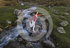 Hand woman yoga and natarajasana pose meditation and relax in the mountain river. Healthy and Zen Concept Close up