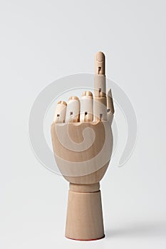 Hand of a wooden doll on a white background