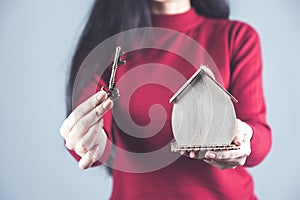 Hand wooden house model with key