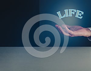 Hand with the word life ,concept of balance in life