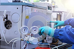 Hand work and start Gas Chromatography Analyzer in laboratory.