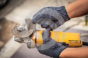 Hand of worker man hold Grinder blades broken . Dangers of using