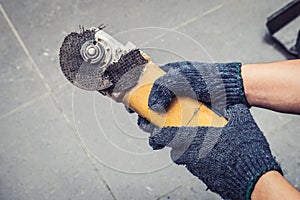 Hand of worker man hold Grinder blades broken . Dangers of using