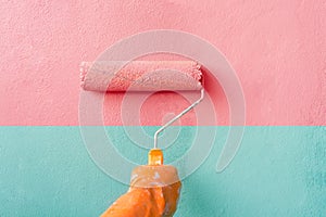 Hand of Worker man painting wall