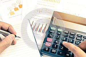 Hand working with business documents.