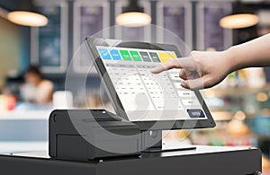 Hand working cashier machine photo