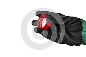 A hand in a working rubberized glove holds a red cap. Isolate on a white background.