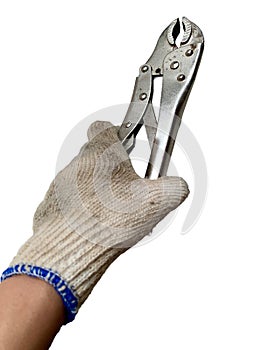 Hand in worn work glove holding a shiny locking plier, isolated on white background.