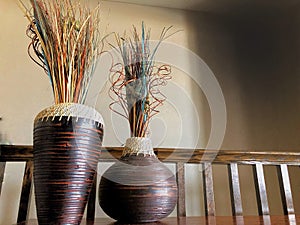 Hand woven vases with multi-colored reeds