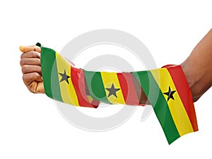 Hand wrapped in Ghanaian flag. fist with flag isolated on white background