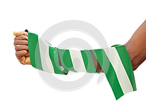 Hand wrapped in Nigerian flag. fist with flag isolated on white background