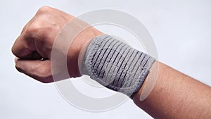 hand with wrist support against white background.