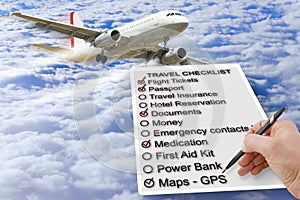 Hand write a Travel Checklist over a cloudy sky and airplane - c