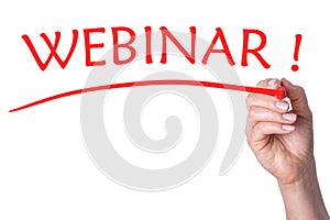Hand writes word webinar with red marker
