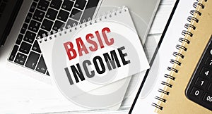 Hand writing Basic income with marker, concept