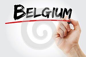 Hand writing Belgium with marker, concept background