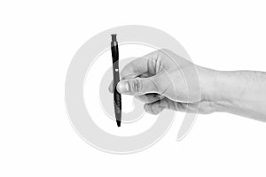 Hand writing and calligraphy. Writing pen in male hand. Ballpoint pen isolated on white. Office stationery. Business