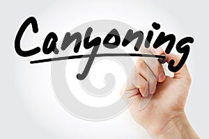 Hand writing Canyoning with marker