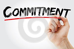 Hand writing Commitment with marker, business concept background