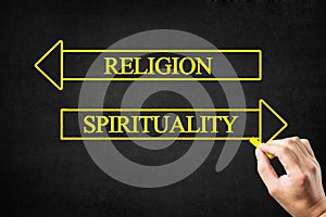 Religion vs Spirituality Opposite Arrows Concept. photo