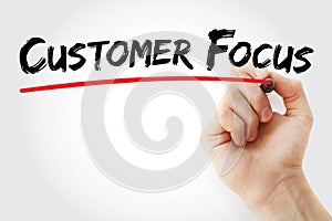 Hand writing Customer Focus with marker, concept background