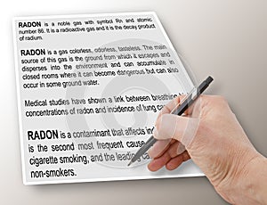 Hand writing a definition and explanation of natural dangerous Radon Gas - concept image