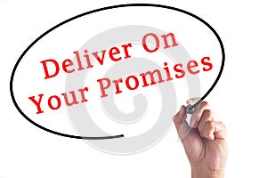 Hand writing Deliver On Your Promises on transparent board photo