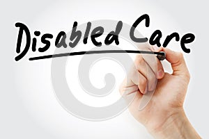 Hand writing disabled care with marker