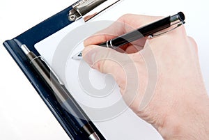 Hand writing on an empty document in a clipboard