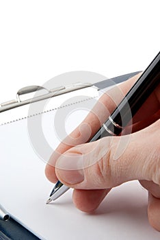 Hand writing on an empty document in a clipboard