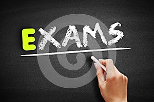 Hand writing Exams on blackboard, business concept background