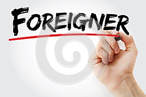 Hand writing Foreigner with marker photo