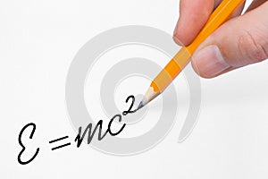 Hand writing formula on paper